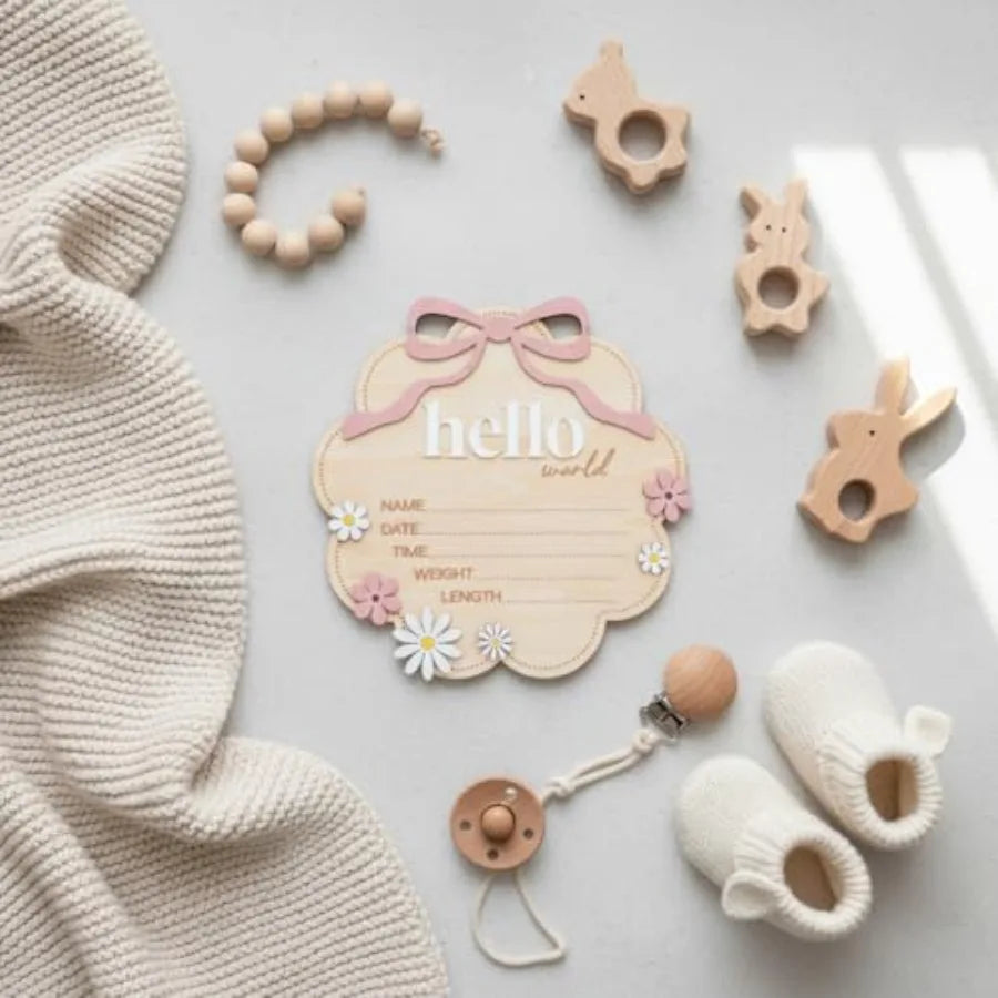 Hello World Wooden Baby Birth Announcement Sign with Pink Bow - lifestyle in-use